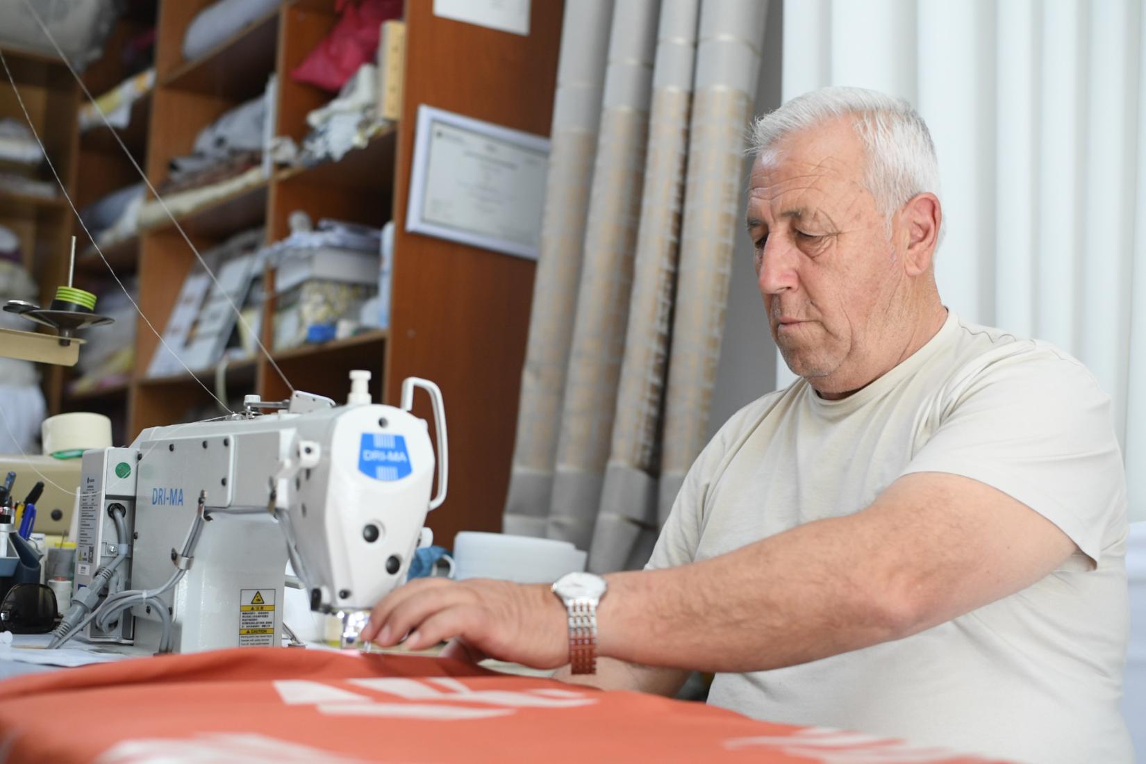 The In Motion programme equipped Rifat with a new sewing machine, and a drill, enabling him to provide services both at home and at other businesses.